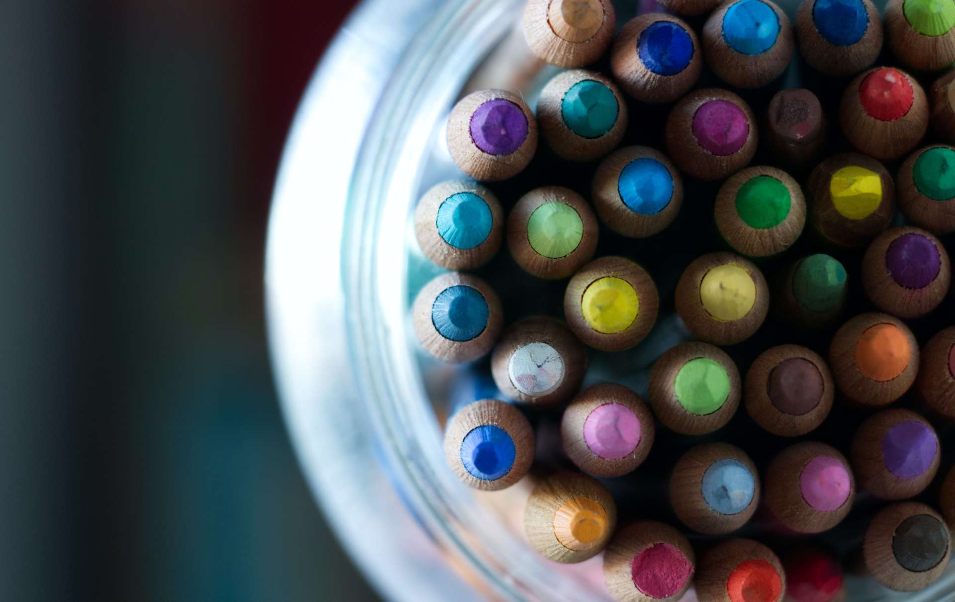 Pot of coloured pencils with tips facing up